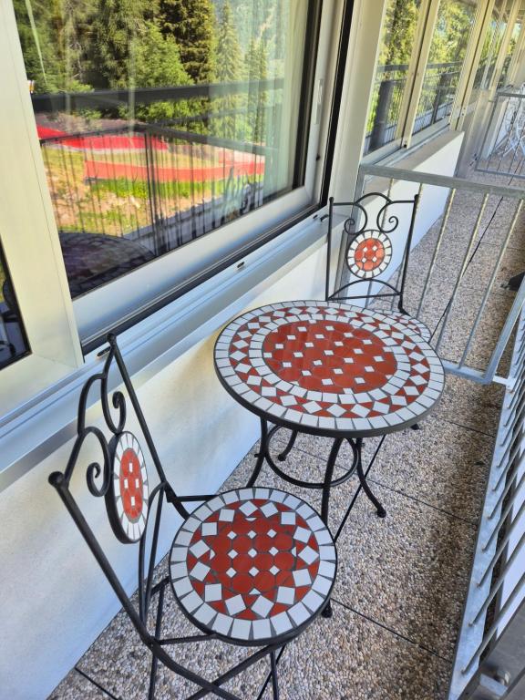 two chairs and a table on a balcony at ''BalconyView'' by Staymarilleva1400 in Marilleva