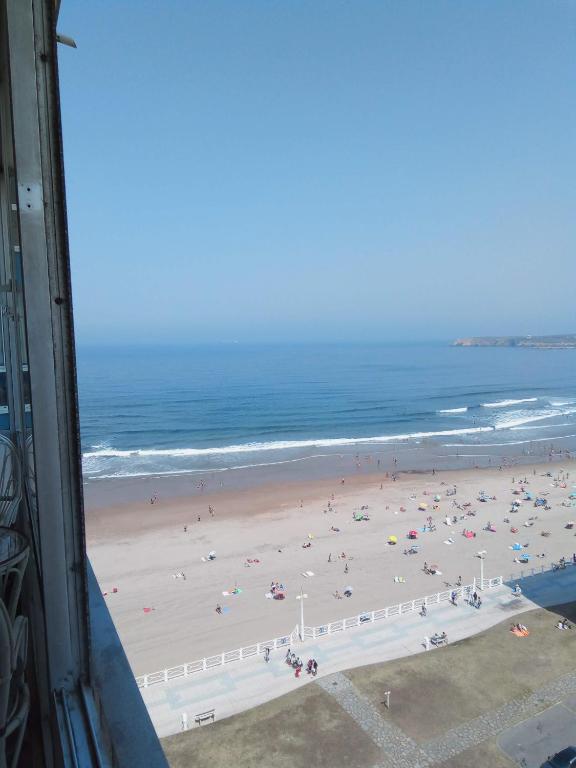 a view of a beach with a lot of people at salinas playa in Salinas