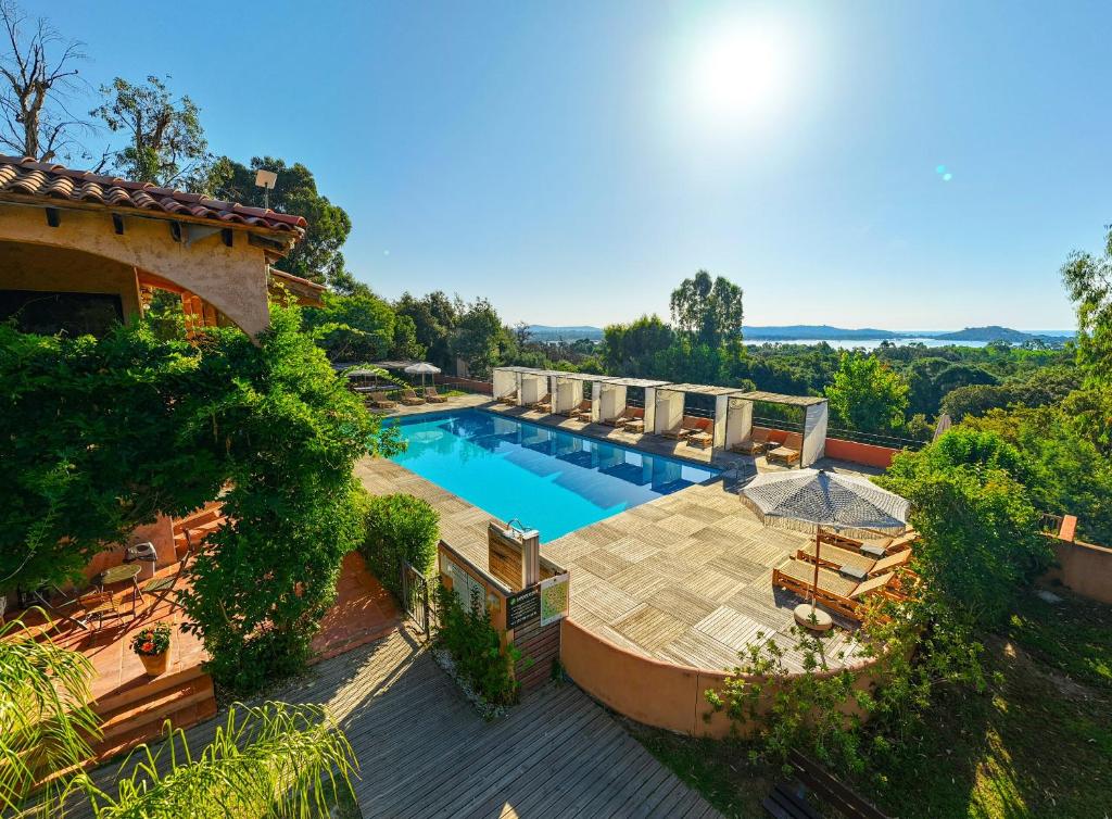 an overhead view of a swimming pool in a house at Royal Palm in Porto-Vecchio