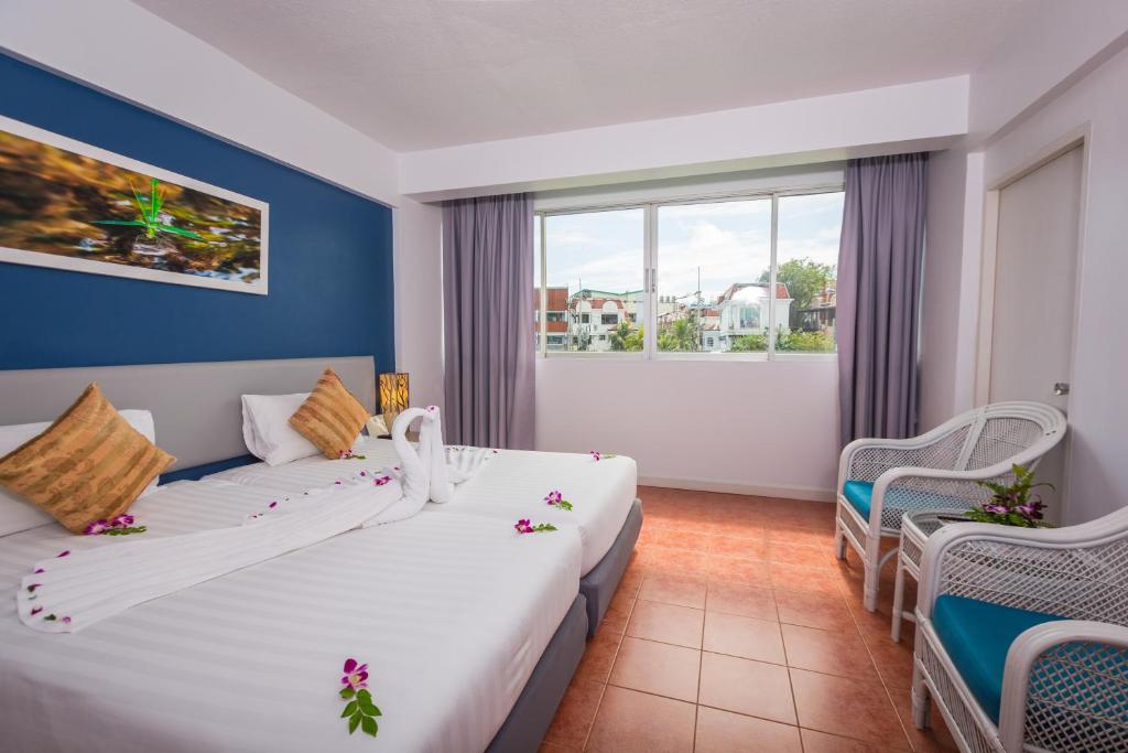 Postel nebo postele na pokoji v ubytování ON Hotel Phuket - SHA