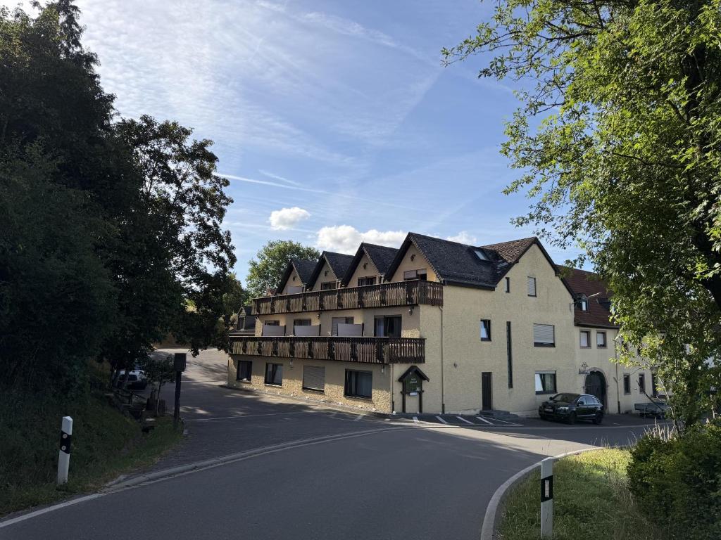 a large building on the side of a road at Hotel Eulenhof in Gransdorf