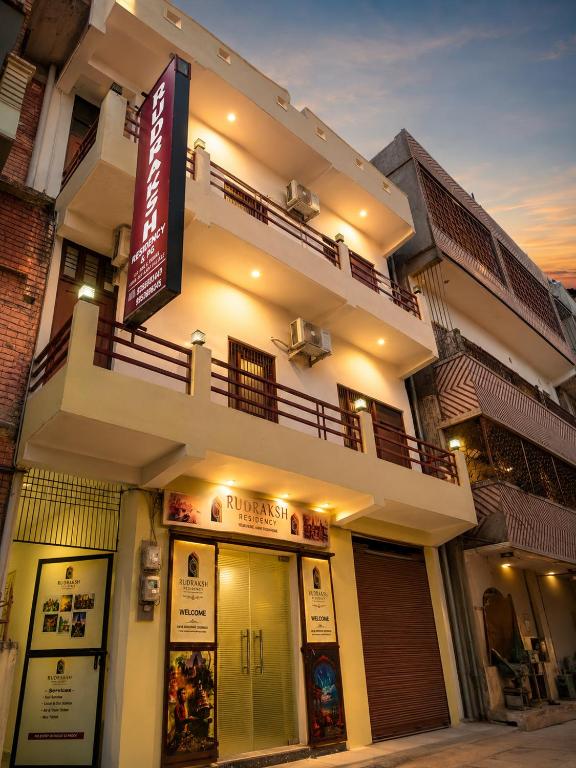 a building with a sign in front of it at Rudraksh Residency in Varanasi