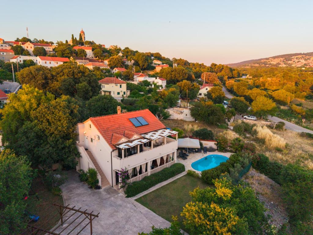 an aerial view of a house with a pool at Vikendica Donji Humac in Donji Humac