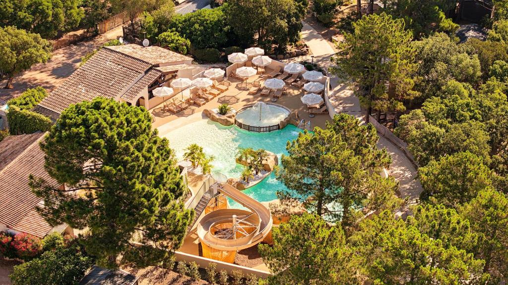 an overhead view of a swimming pool with a resort at Campo Di Mare in Porto-Vecchio
