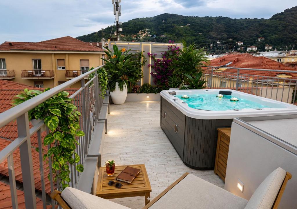 a hot tub on the balcony of a building at Alassio Black Loft in Alassio