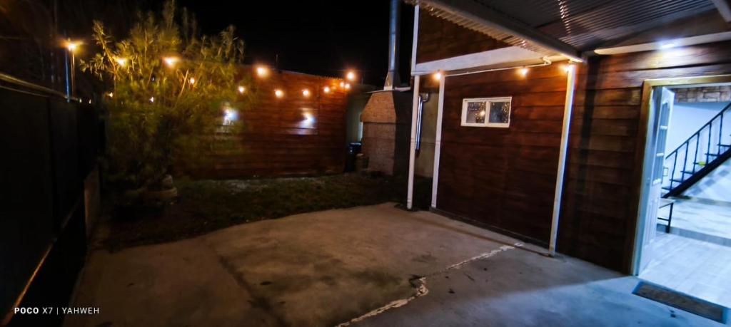 an empty garage at night with lights on it at Yahweh temporarios in Río Grande