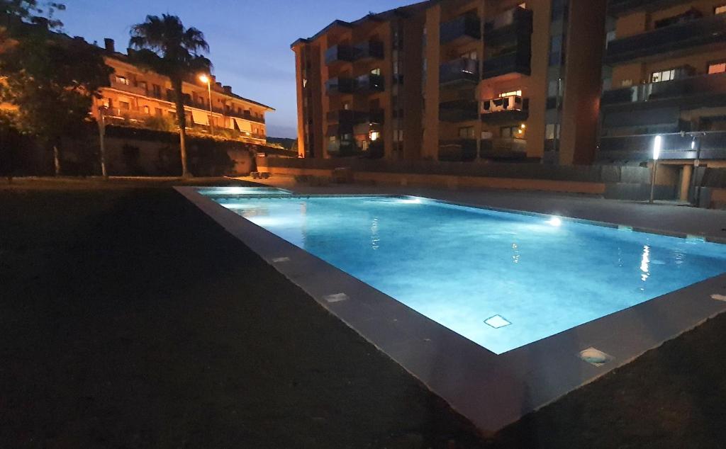 an empty swimming pool in a building at night at Boadella-Fenals in Lloret de Mar