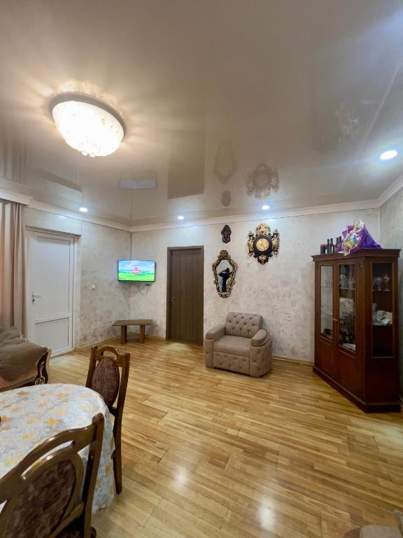 a large living room with a table and a couch at Villa de Ureki in Ureki