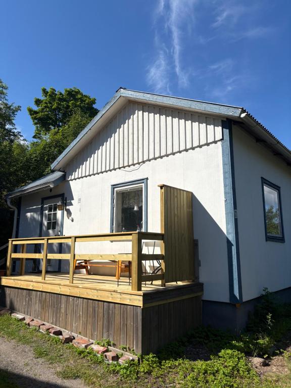 a house with a large deck in front of it at Dockstavägen 7 in Docksta