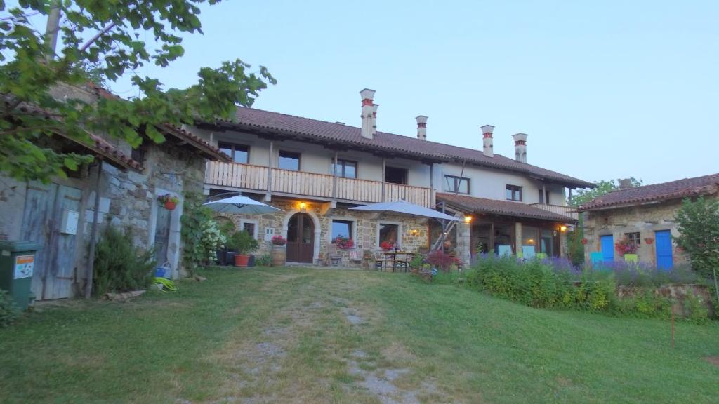a large house with a yard in front of it at Silentium Domus in Gornje Vreme