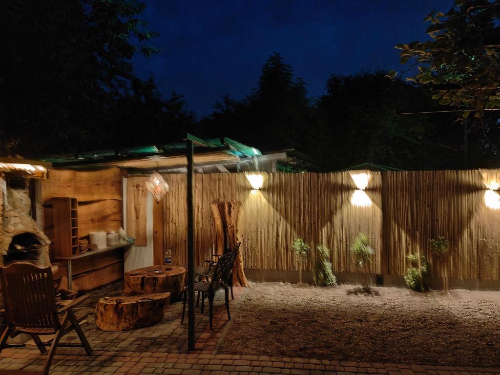 a patio with chairs and a fence at night at El Paso Unin 1 in Unin