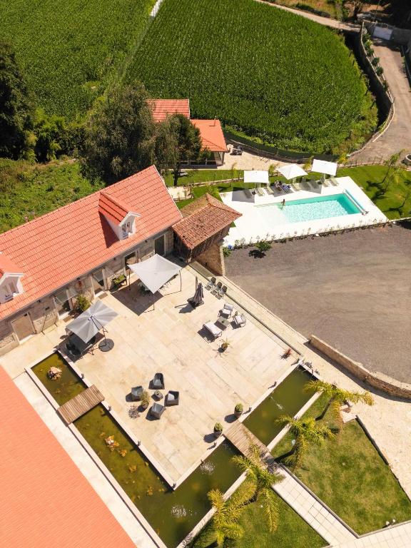 an aerial view of a house with a swimming pool at Lourença Stays - Quinta Lourença in Vilar