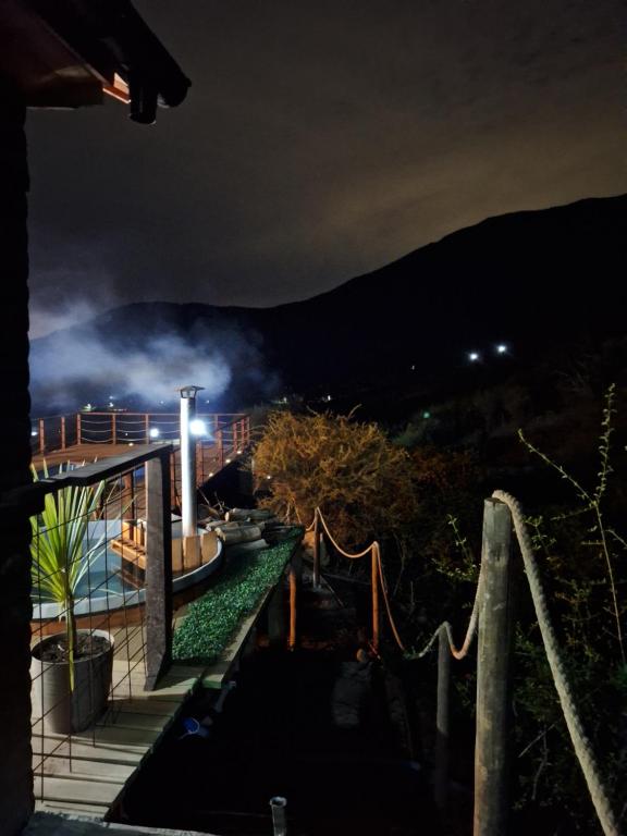 a view from the balcony of a house at night at Tu rinconcito entre cerros in Requínoa