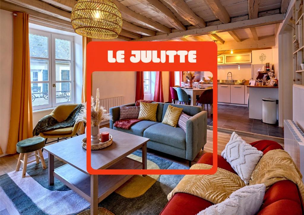 a living room with a couch and a table at "Le Julitte" le logement hyper cosy avec 3 chambres en hyper centre ville in Nevers