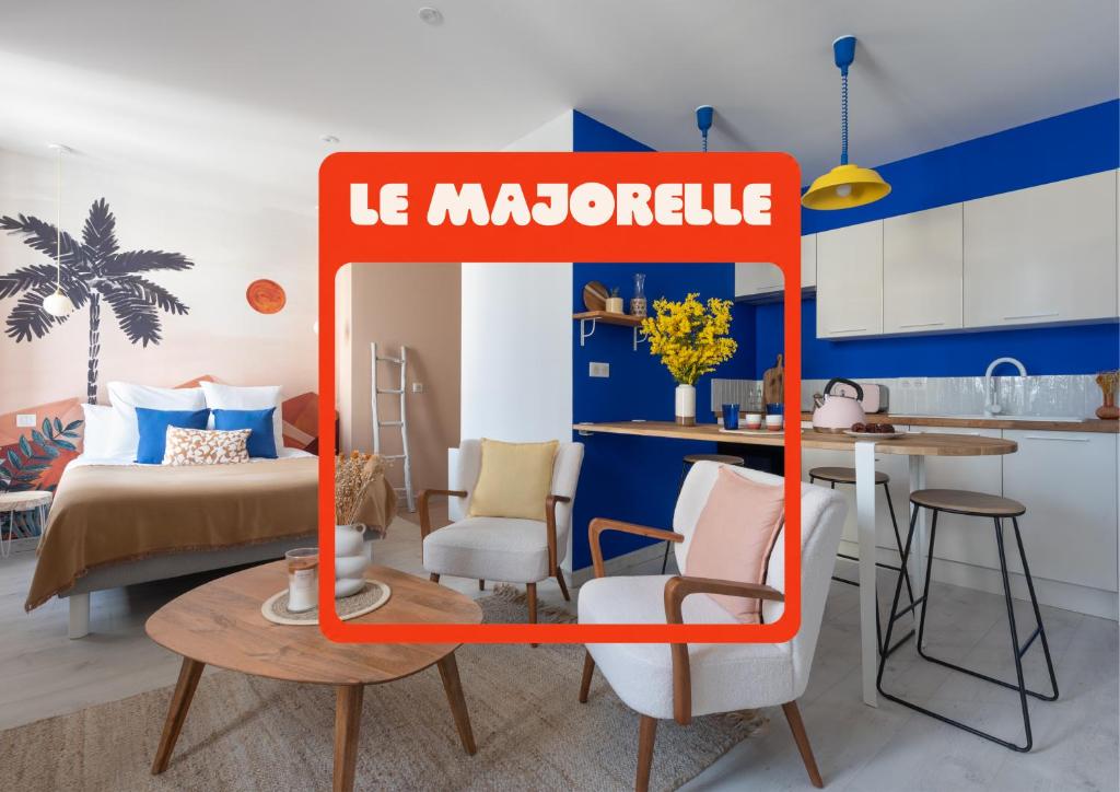 a kitchen and living room with a sign that reads le marmonteu at "Le Majorelle" logement atypique en hyper centre ville de Nevers, avec service premium in Nevers