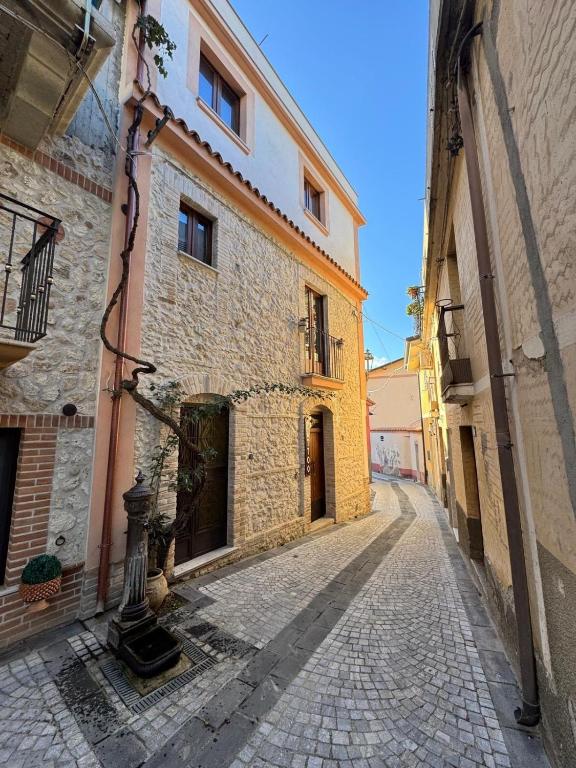 an empty street in an old stone building at Tattoo Home in Martone