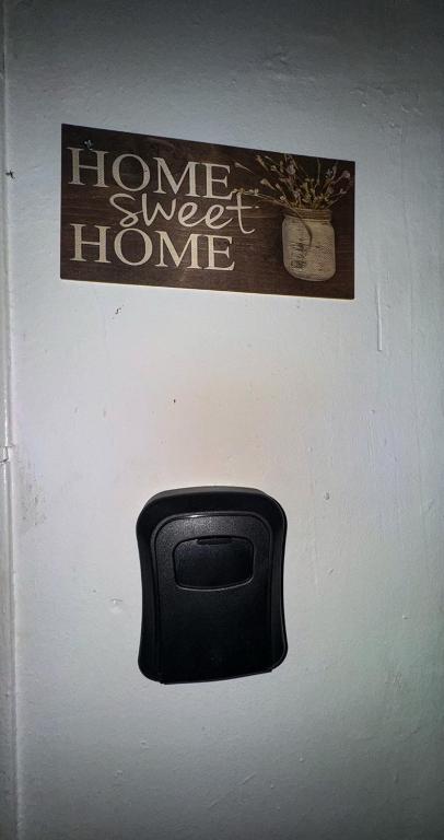 a door with a home sweet home sign and a mailbox at Sisian Sun House in Sisian