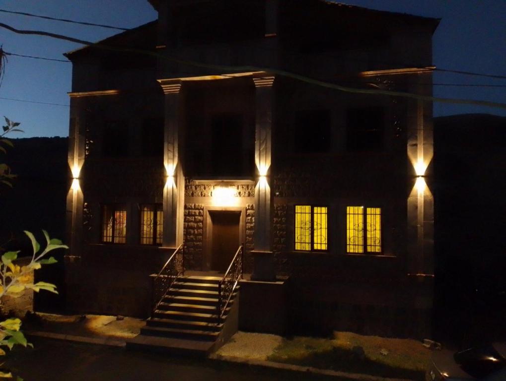 a house with lights on the front of it at Tsaghkadzor Family Rest in Tsaghkadzor