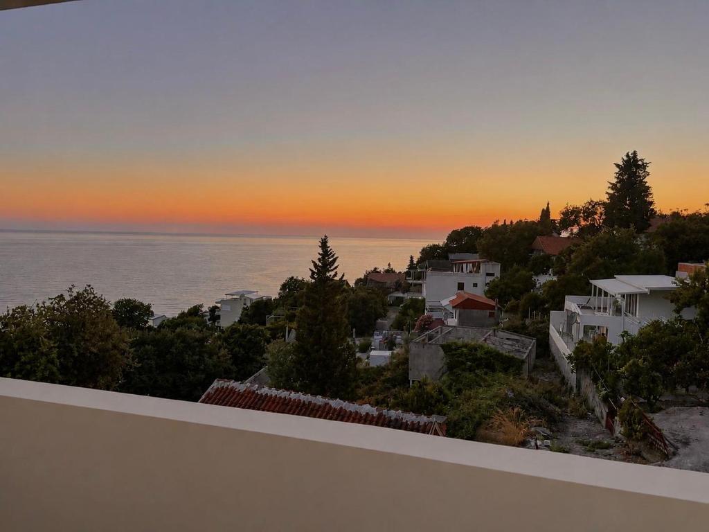 a view of a sunset from the balcony of a house at Darinka in Ulcinj