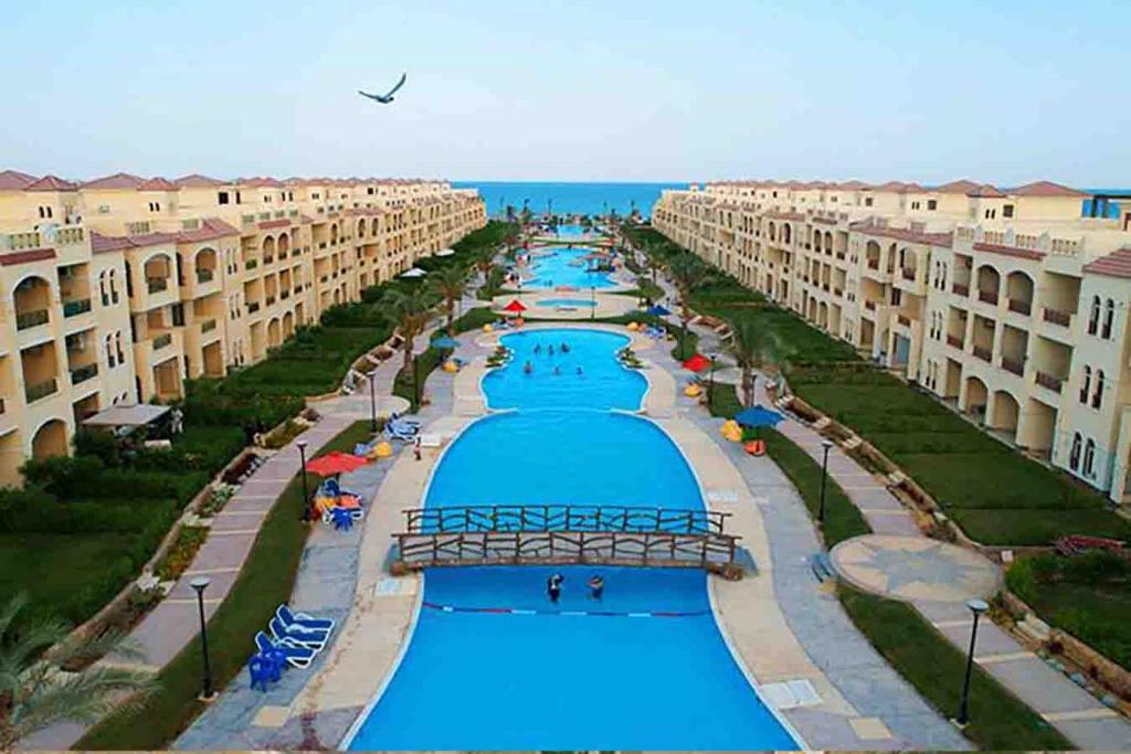 an aerial view of a swimming pool in a resort at Rahaf palm beach chalet in Ain Sokhna