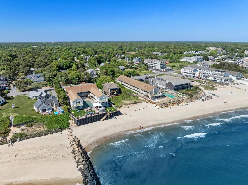 an aerial view of a beach with houses and the ocean at The Corsair & Cross Rip Oceanfront in Dennis Port