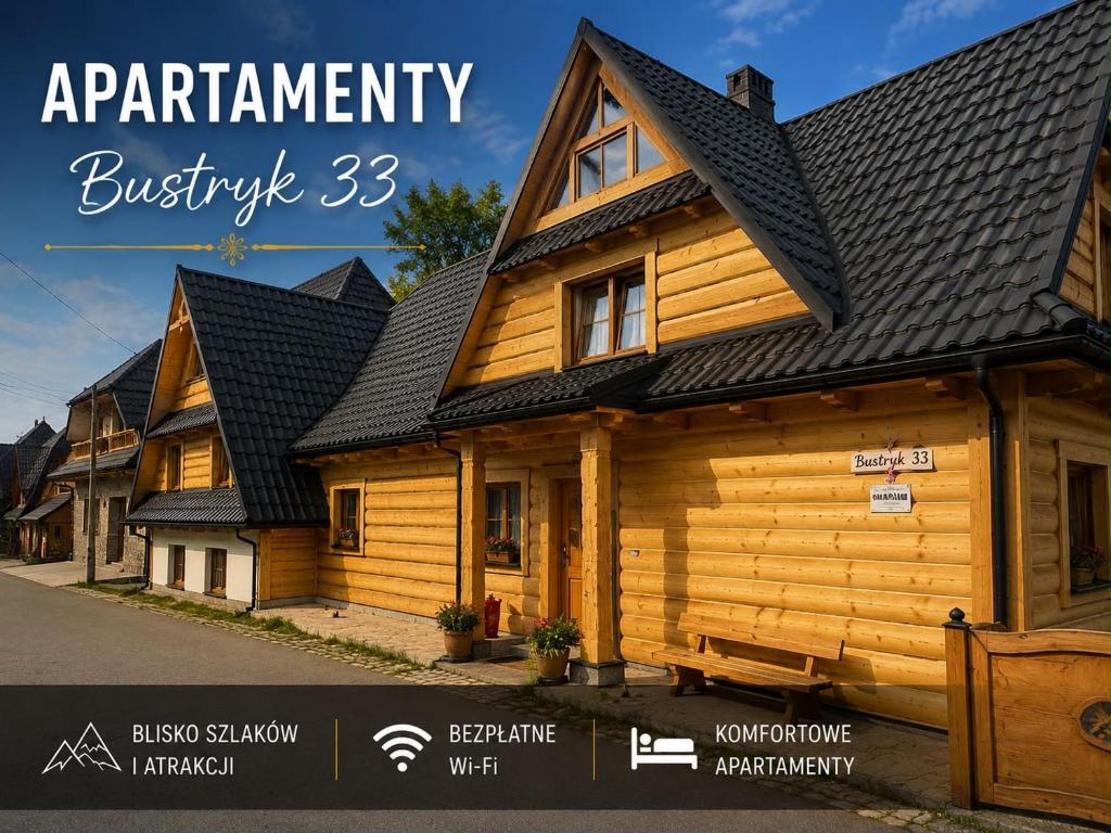 ein Holzhaus mit schwarzem Dach in der Unterkunft Bustryk 33 in Bustryk