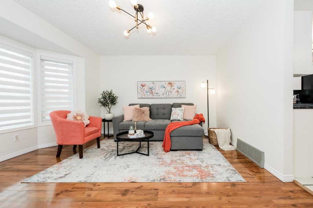 a living room with a couch and two chairs at Fabulous Home-King bed-Easy Access to EVERyTHING! in Edmonton