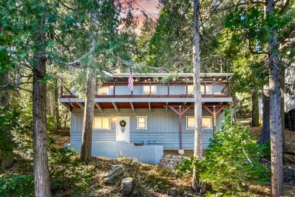 a house in the woods with trees at Idyllic Cabin in the Woods: Cozy Crestline Retreat in Arrowhead Highlands