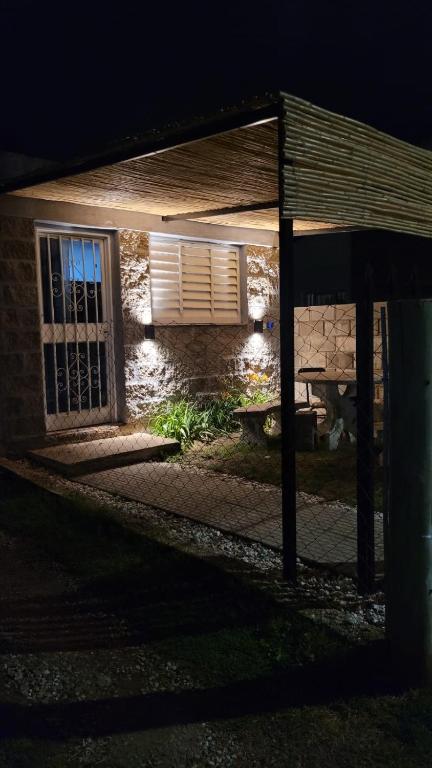 an outside view of a house at night at Monoambiente La Falda in La Falda