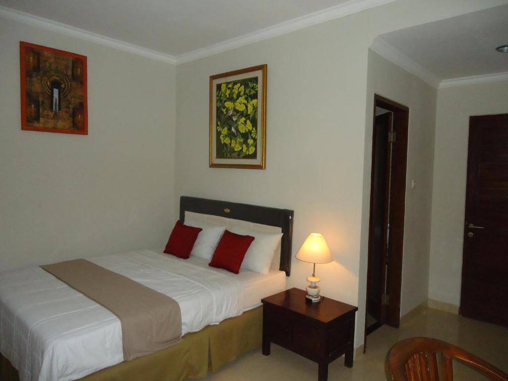 Postel nebo postele na pokoji v ubytování Dewa Put Guest House