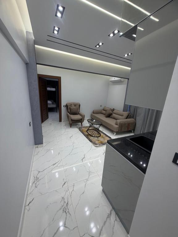 a living room with a couch and a table at Happy apartment 3 in Cairo