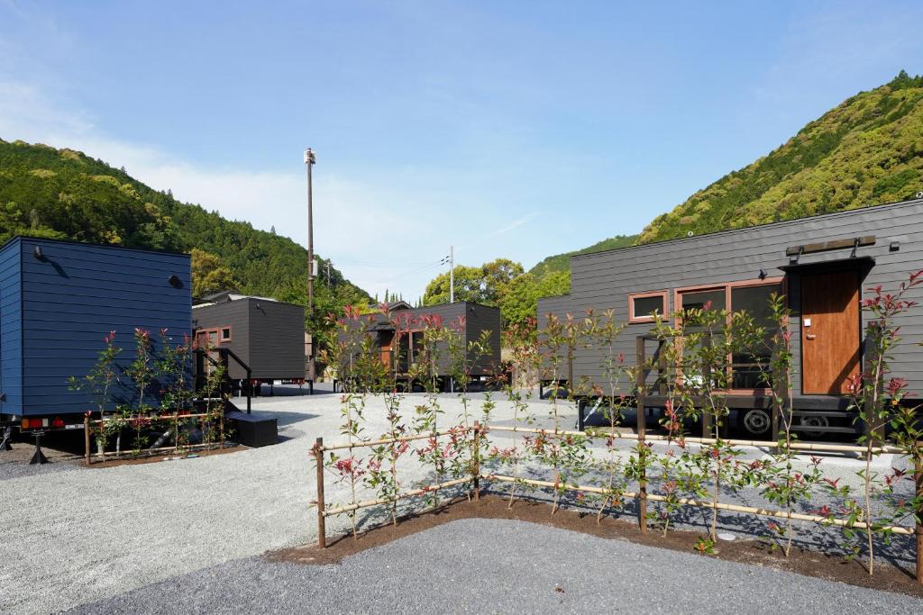 a row of plants in front of a building at SEN RETREAT HONGU - Kumano Kodo Gateway in Tanabe