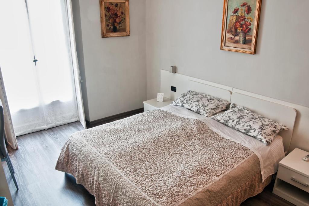 Posteľ alebo postele v izbe v ubytovaní Flaneur