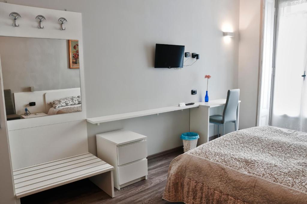 Posteľ alebo postele v izbe v ubytovaní Flaneur