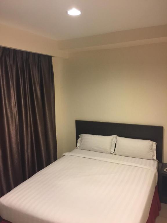 Postel nebo postele na pokoji v ubytování Premierz Hotel