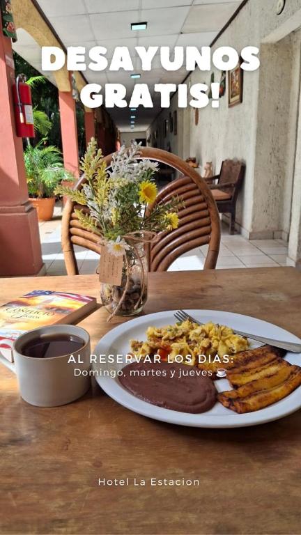 a plate of food on a table with a plate of food at Hotel La Estacion in La Unión