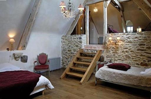 Postel nebo postele na pokoji v ubytování Manoir de la Villeneuve