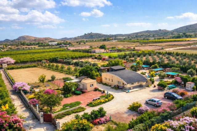 an aerial view of a house with a parking lot at Finca Tolomó in Aspe