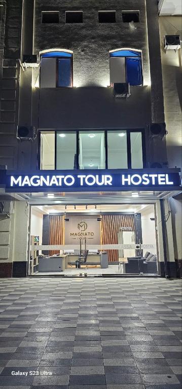 a hospital building with a sign that reads macaratoour hospital at Magnato Hostel in Andizhan