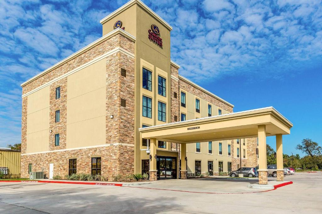 a building with a clock tower on top of it at Comfort Suites Channelview - Houston East in Channelview