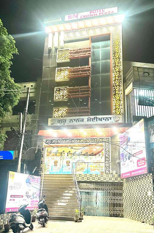 a building with a set of stairs in front of it at Hotel Crown Plaza in Hoshiārpur