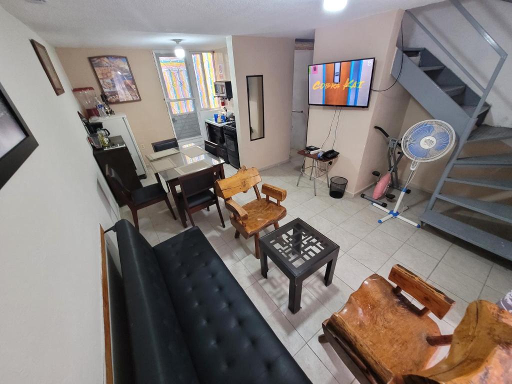 an aerial view of a living room with a staircase at Liz in Matehuala