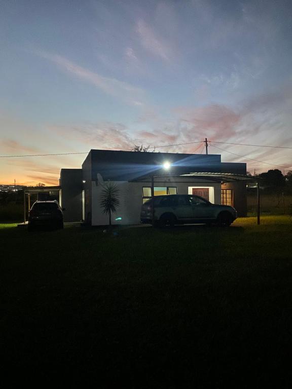 a car parked in front of a house at night at EeeLSii Health Rest in Manzini