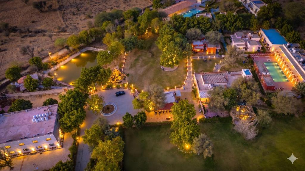 an overhead view of a mansion with a garden and lights at Thar Exotica Hotel & Resort Bikaner in Bikaner