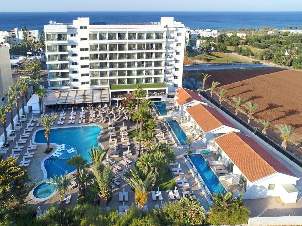 an aerial view of a resort with a swimming pool at Bohemian Gardens Hotel in Protaras