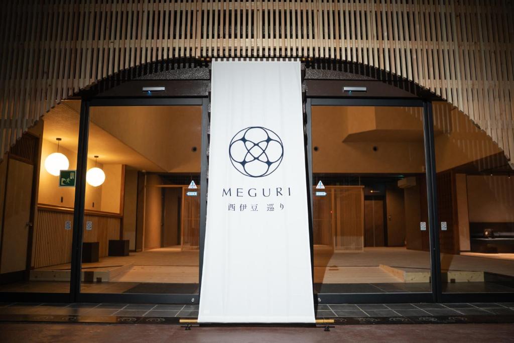 a sign in the middle of a building at 西伊豆 巡り in Ukusu