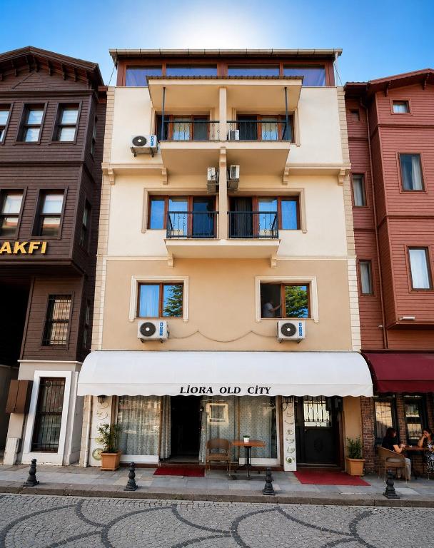 a building with a sign that reads lola our city at Liora Old City in Istanbul