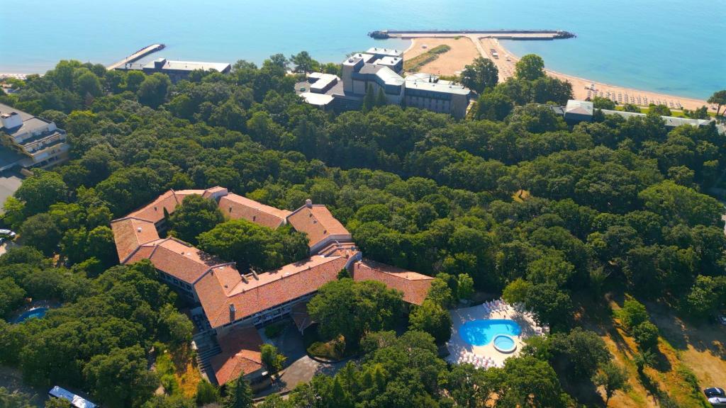 an aerial view of a house with a swimming pool at Hotel PRESLAV in Golden Sands