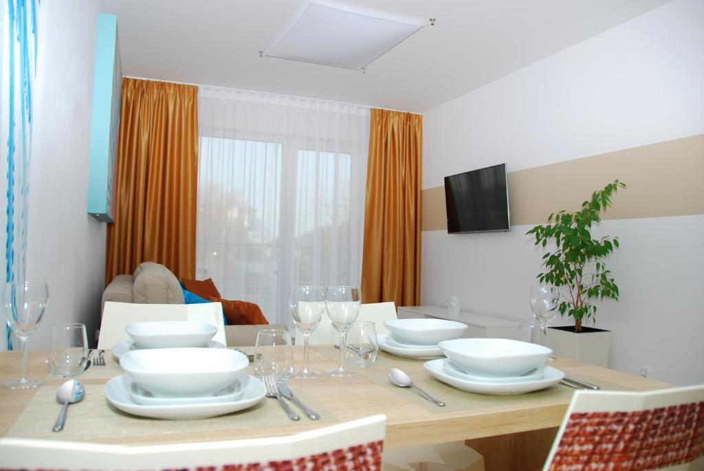 Televízia a/alebo spoločenská miestnosť v ubytovaní Apartamenty REZULAK Solna B104 204 303
