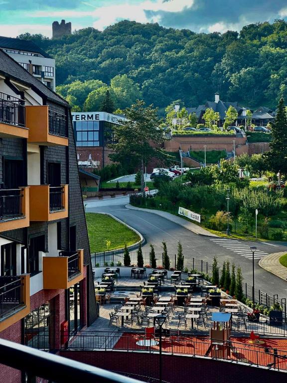 a view from a balcony of a building with a street at Fruške 202 studio apartman in Vrdnik